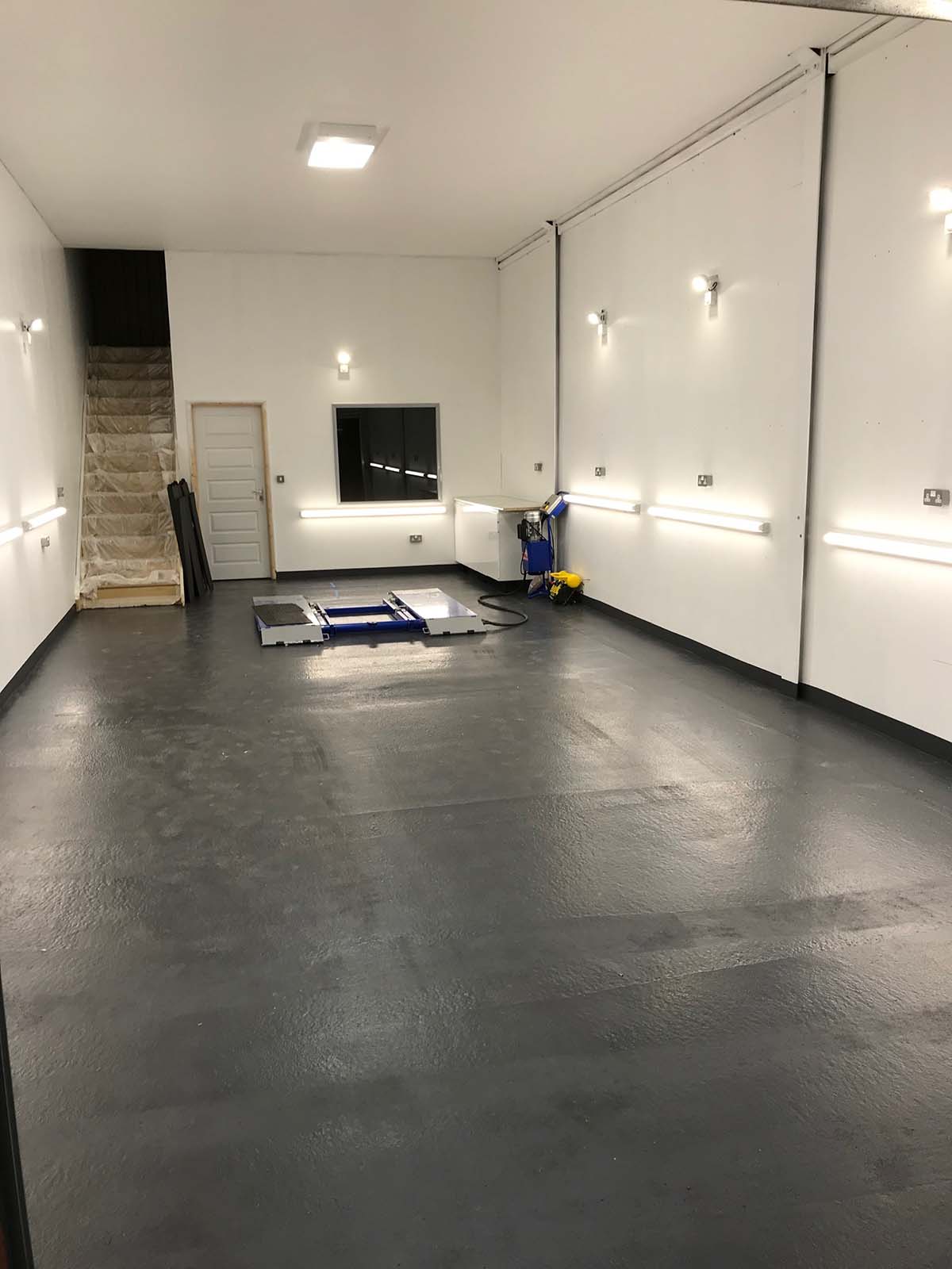 white garage interior with various spotlights