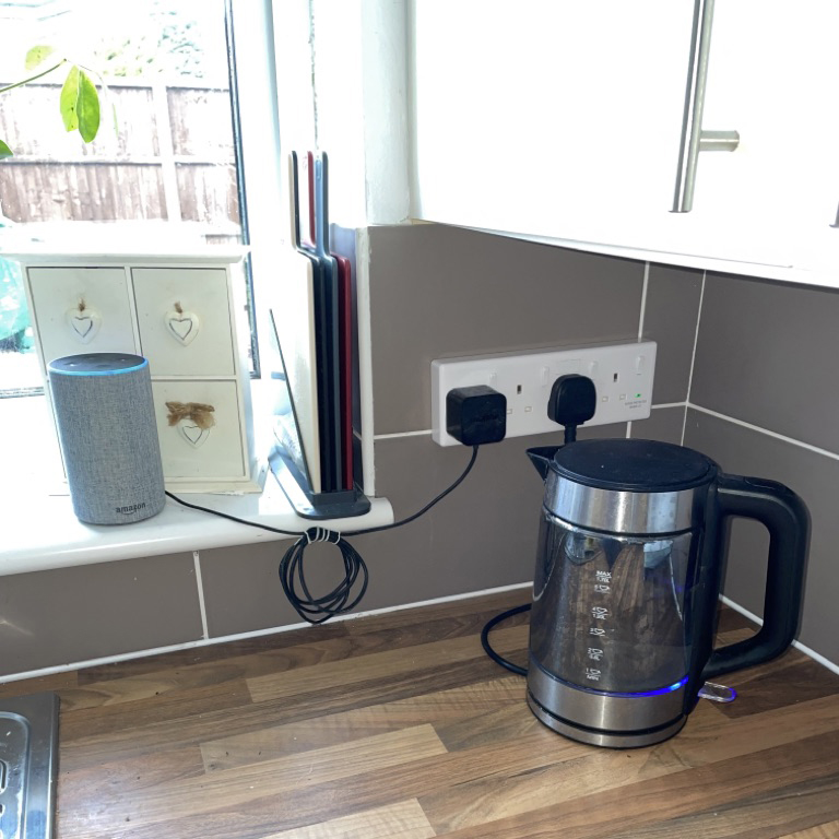 newly installed four section plug socket keeping appliance wires tidy