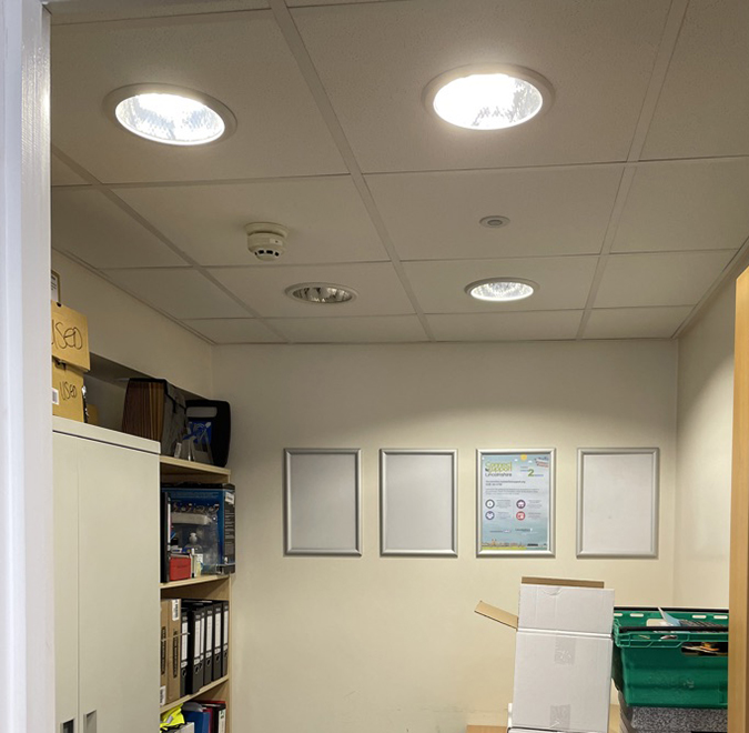 Before picture of office with yellow toned lights